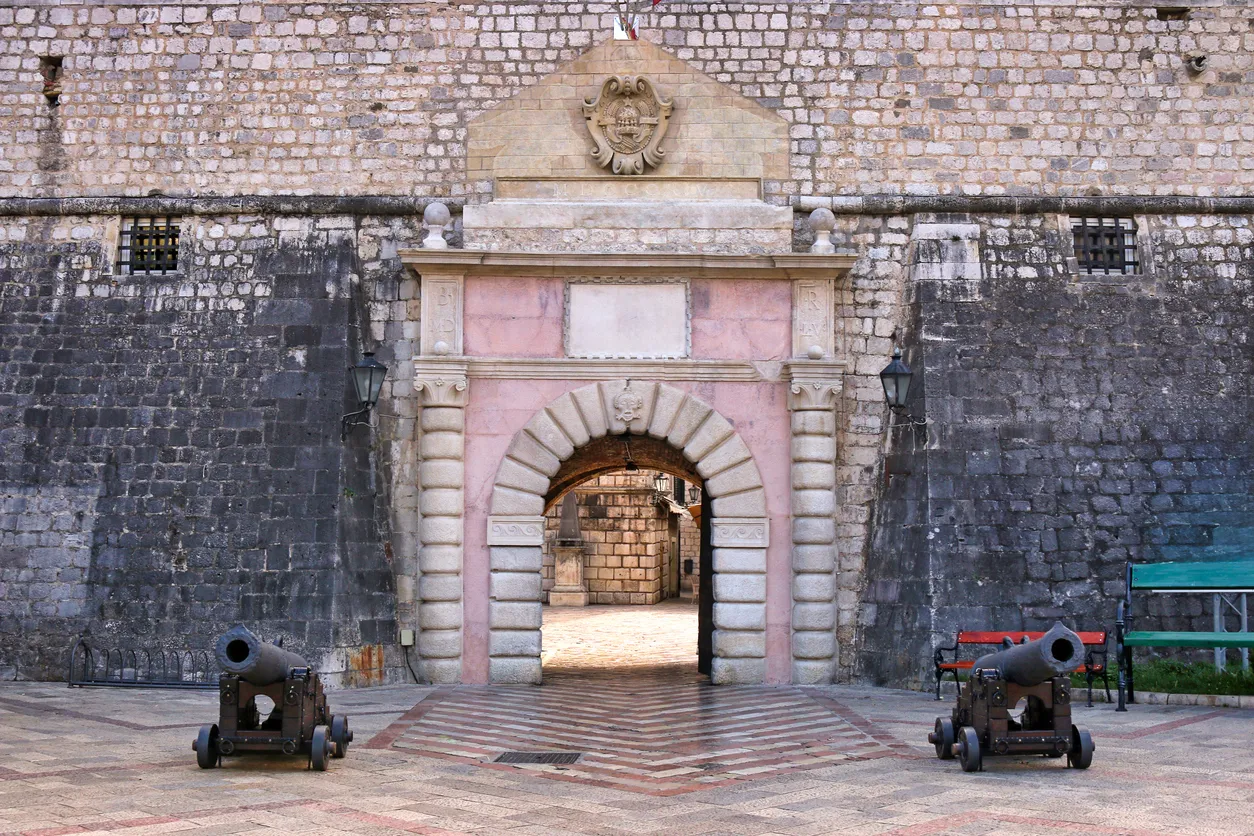 Sea Gate entrance to Kotor old town with historic cannons, Montenegro.jpg